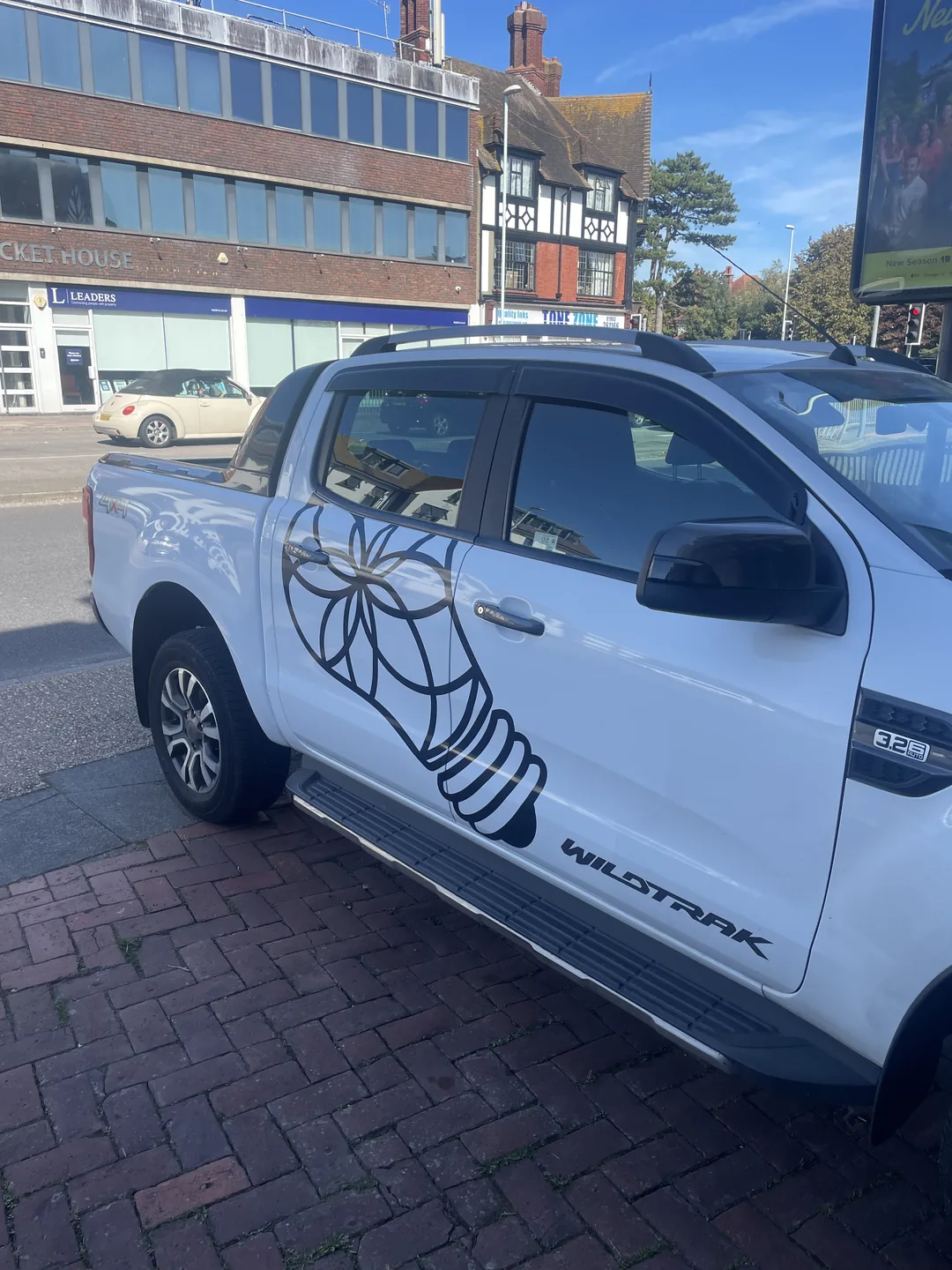 AS Electrical And Renewables branded pickup with the company logo in West Sussex