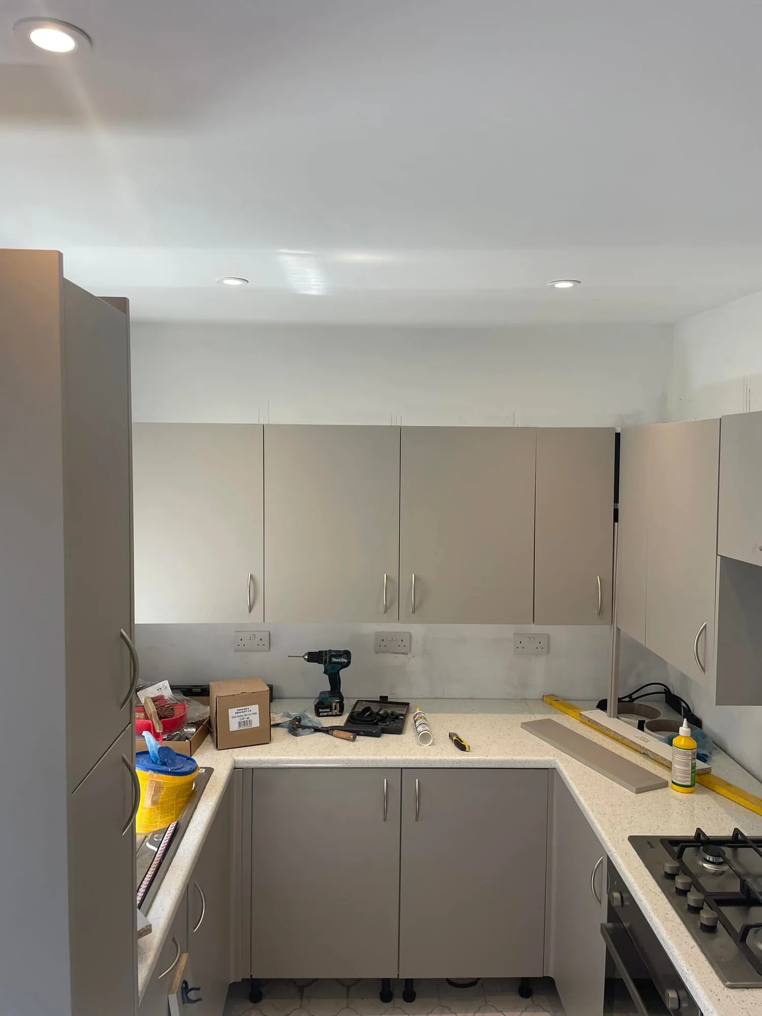 Kitchen refurbishment with new spotlights and sockets being fitted