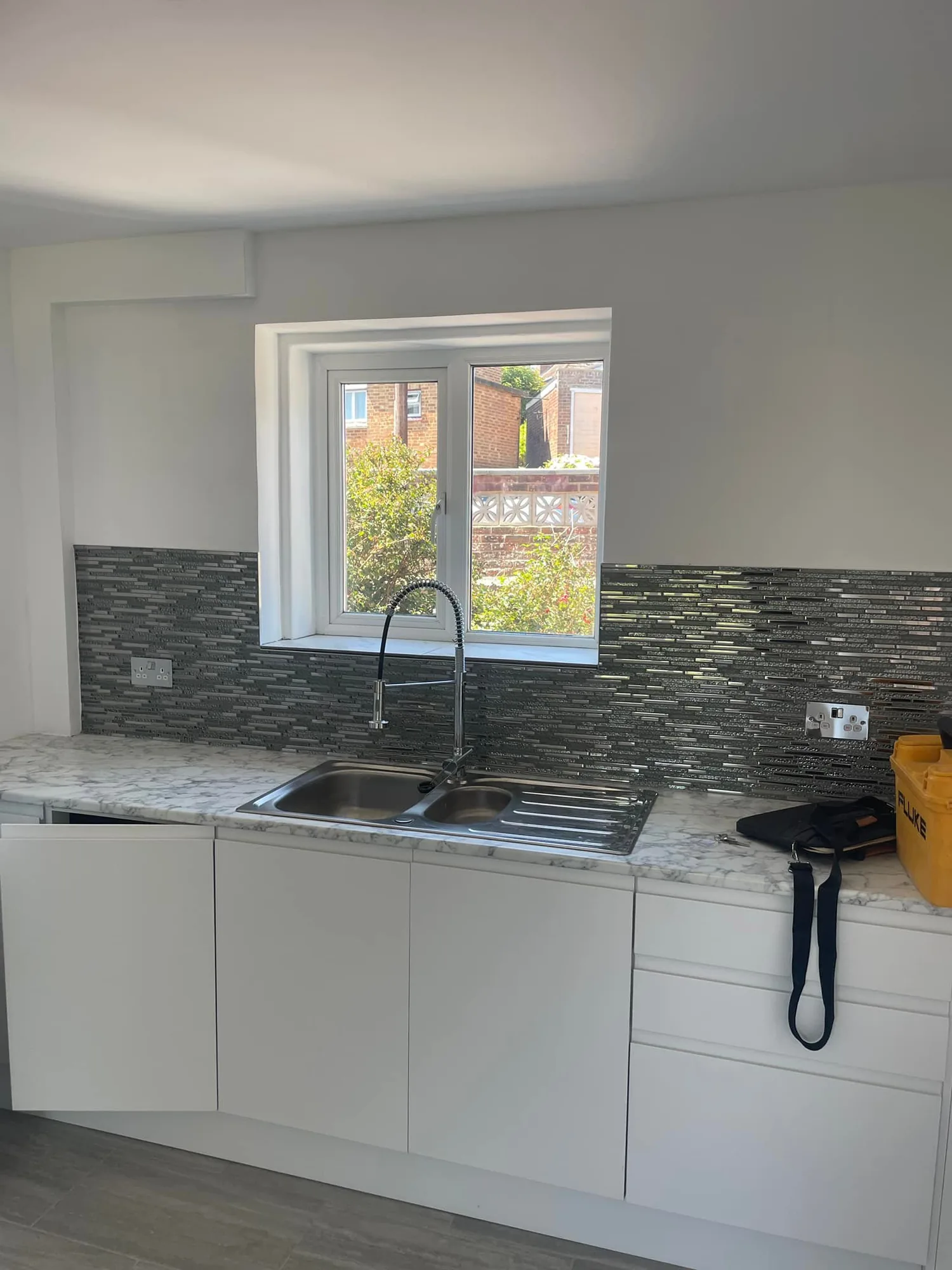 Completed kitchen with sockets and lighting installed by an electrician