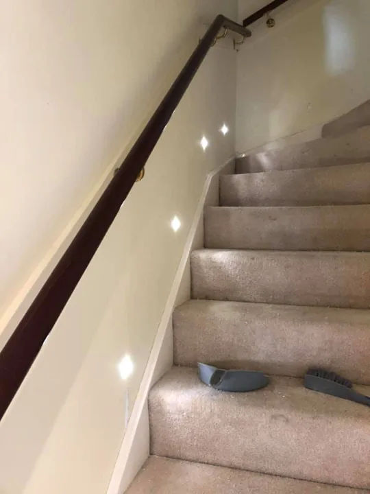 Recessed stair lighting installed along a staircase