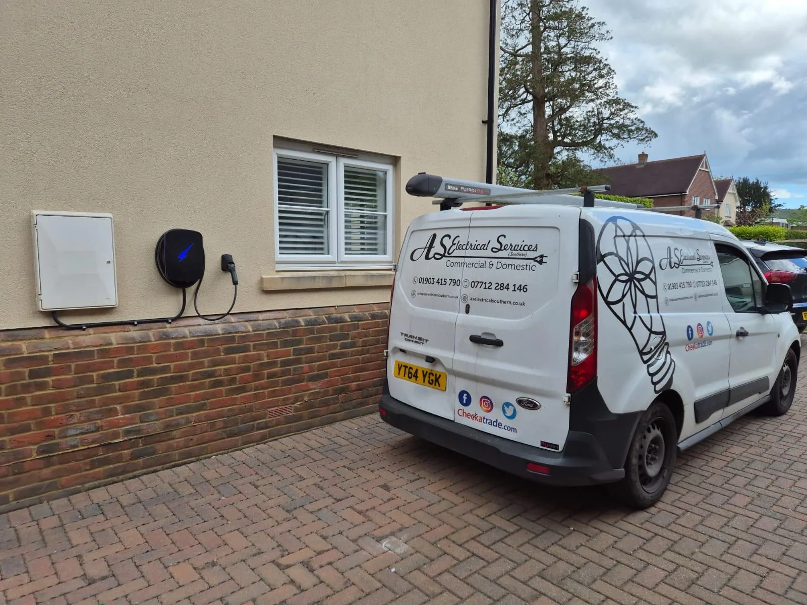AS Electrical van parked beside a newly installed home EV charging point